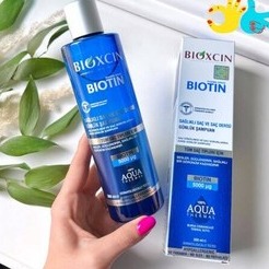 شامپو ضد ریزش مو بیوکسین مدل biotin حجم 300 میل