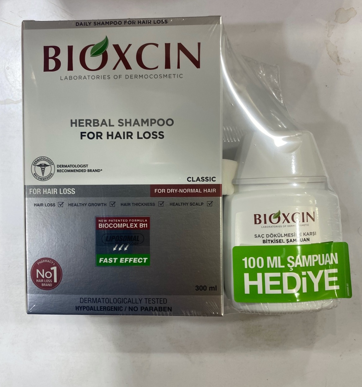 شامپو بیوکسین سفید مخصوص موهای خشک واسیب دیده همراه با هدیه